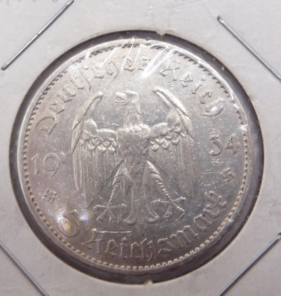 Obverse The German eagle dividing the date with the value at the bottom. Lettering: Deutsches Reich 19 34 5 Reichsmark 