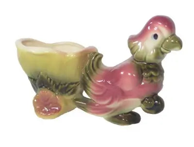 pink green and yellowparrot pulling a cart hull pottery